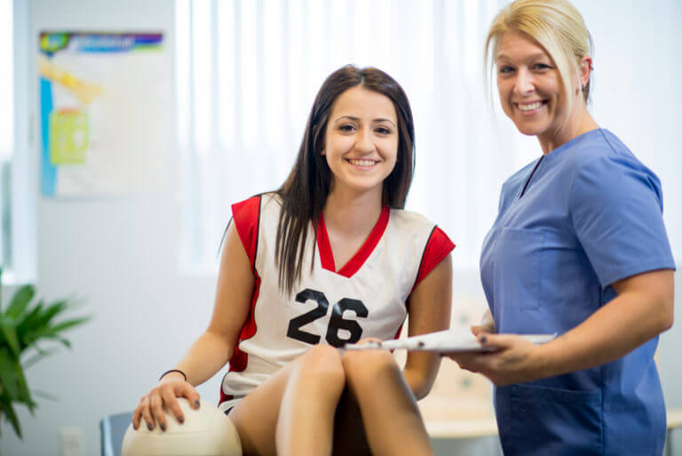 Teen smiling with doctor