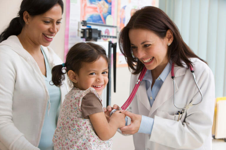 Pediatrician examining a child
