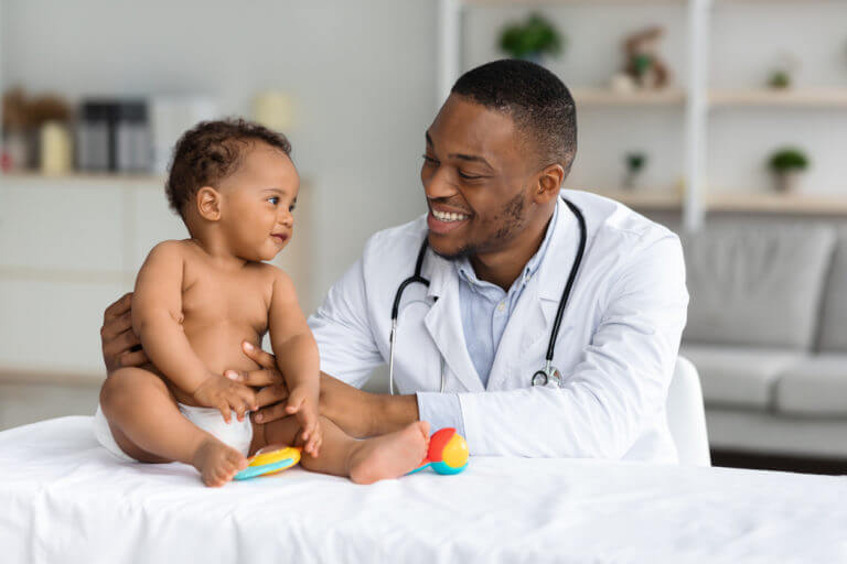 Doctor Making Check Up For Infant Baby Boy